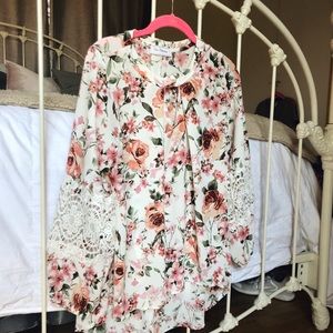 Floral top with crochet detail.